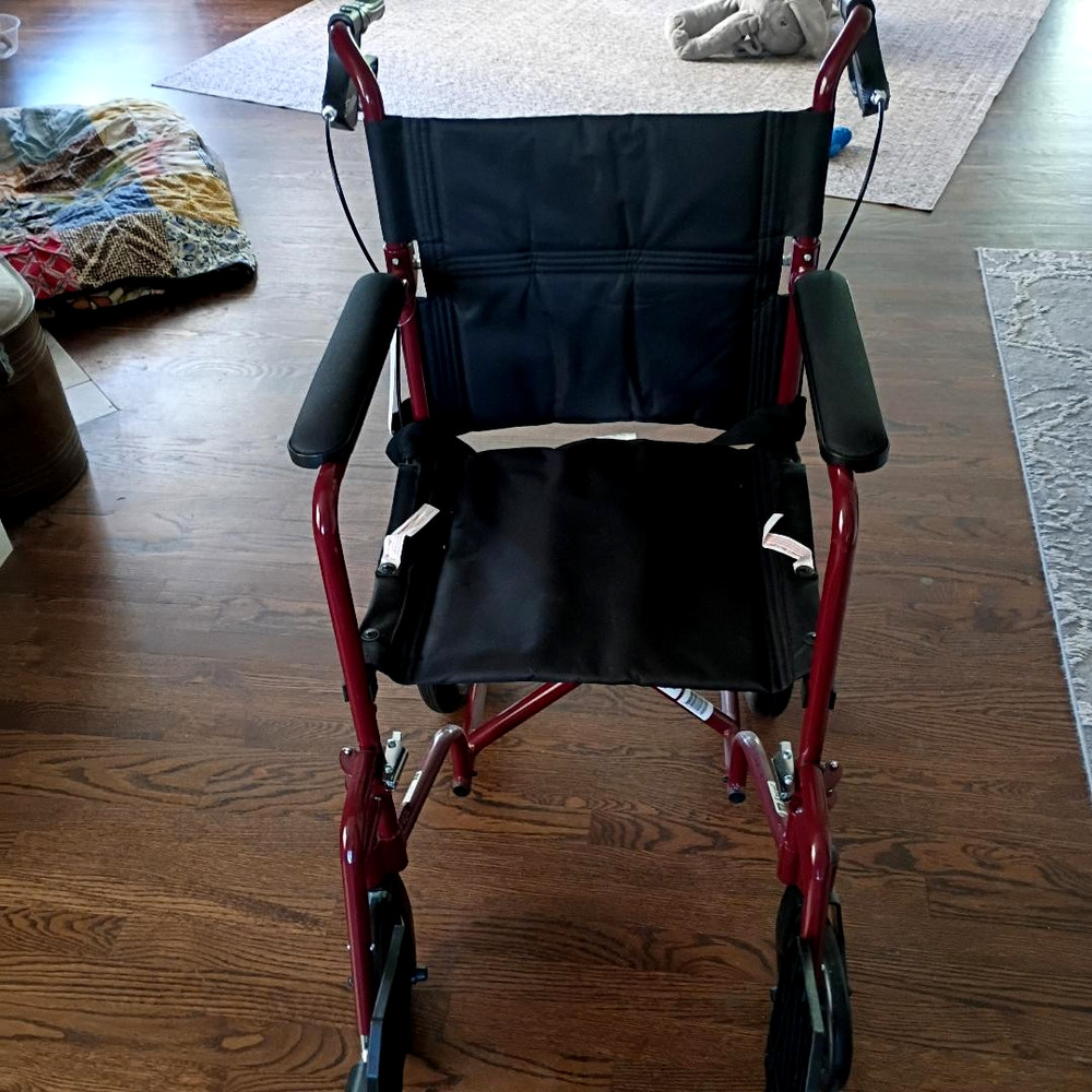 Medline Transport Wheelchair with hand grip brakes for more secure handleing
