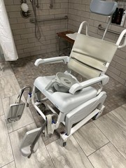 Brand new Quantum power chair, lightly used shower chair and other medical equip
