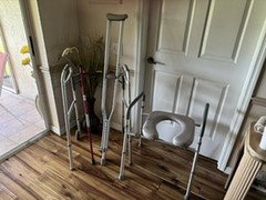 Raised adjustable toilet seat, cane, walker, and crutches.