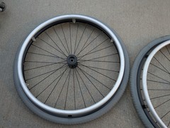 Out Front Shadow Spoke Wheelchair Wheel Pair 22″ 501mm Solid Tire Alum Handrim