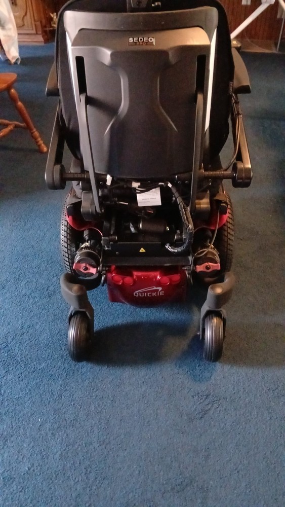Electric wheel chair red and black Quickie Q500M promaybe has 2 hours on it