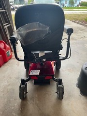 Candy Red Jazzy Select Elite ES power wheelchair with charger