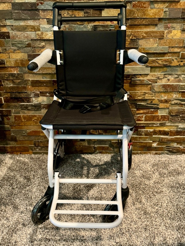 Lightweight transport chair, weighing only 15 pounds. Brand new, in the box.