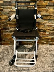 Lightweight transport chair, weighing only 15 pounds. Brand new, in the box.
