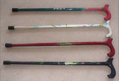 Set of four hand painted canes, each approximately 31″ tall. Gently worn