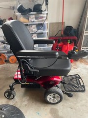 Candy Red Jazzy Select Elite ES power wheelchair with charger