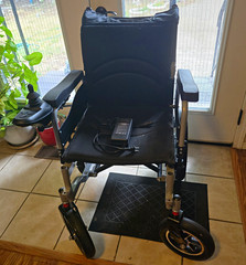 Black Electric Powered Wheelchair Battery with Joystick Control Charger
