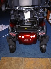 Electric wheel chair red and black Quickie Q500M promaybe has 2 hours on it