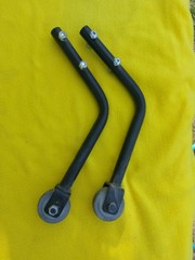A PAIR OF QUICKIE V-121 MOTORIZED WHEELCHAIR ANTI-TIPPERS With Bolts