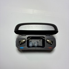 Left and Right Resound GN Hearing Aids and charging station w/cord.