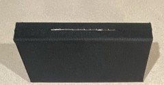 Starkey branded hearing aid hard case durable black mesh-like exterior.