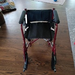Medline Transport Wheelchair with hand grip brakes for more secure handleing