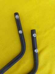 A PAIR OF QUICKIE V-121 MOTORIZED WHEELCHAIR ANTI-TIPPERS With Bolts
