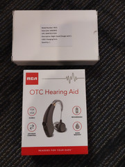 New Sealed RCA OTC Behind-the-Ear Hearing Aid with Recharging Stand – Left/Right