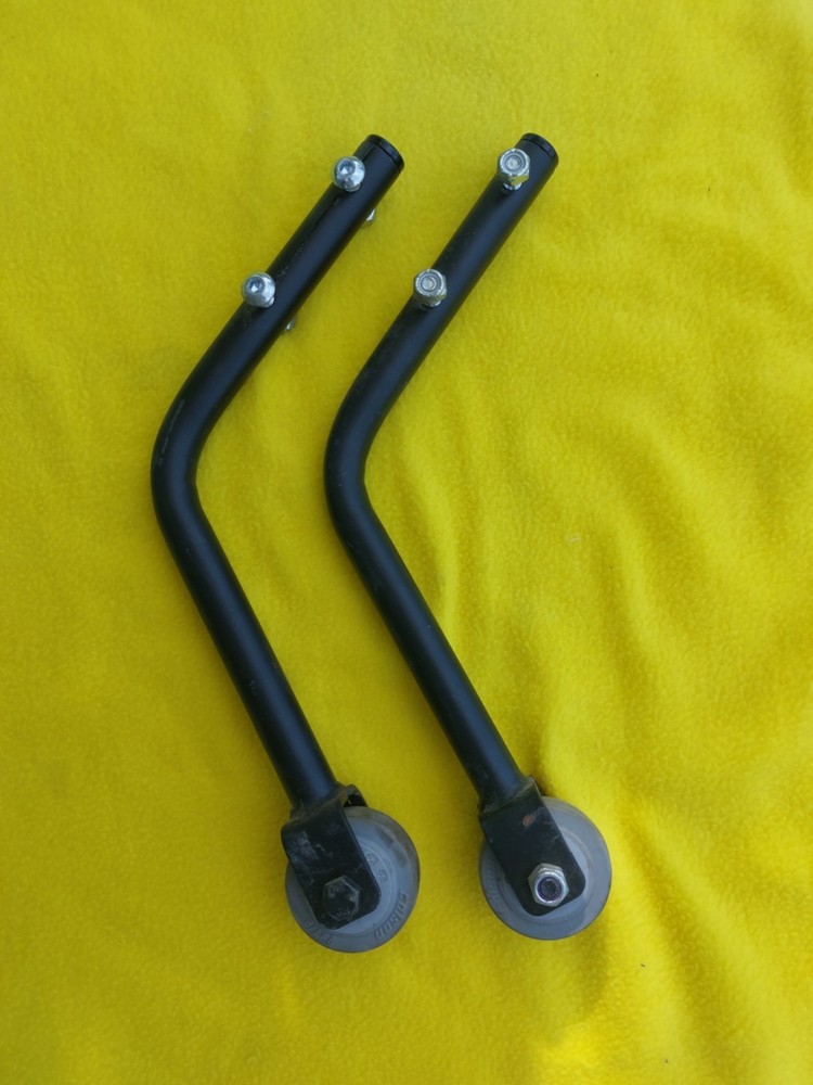 A PAIR OF QUICKIE V-121 MOTORIZED WHEELCHAIR ANTI-TIPPERS With Bolts