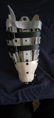 Adjustable Geometric Leg Brace for Stabilization, Beige Gray Black Plastic Foam
