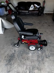 Jazzy Power Wheelchair w/ Joystick, Padded Armrests, Footrest, 4-Wheel Red/Black
