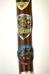 WOOD CANE WITH ELEVEN (11 ) HAND PAINTED ENAMEL METAL BADGE’S (GERMANY )