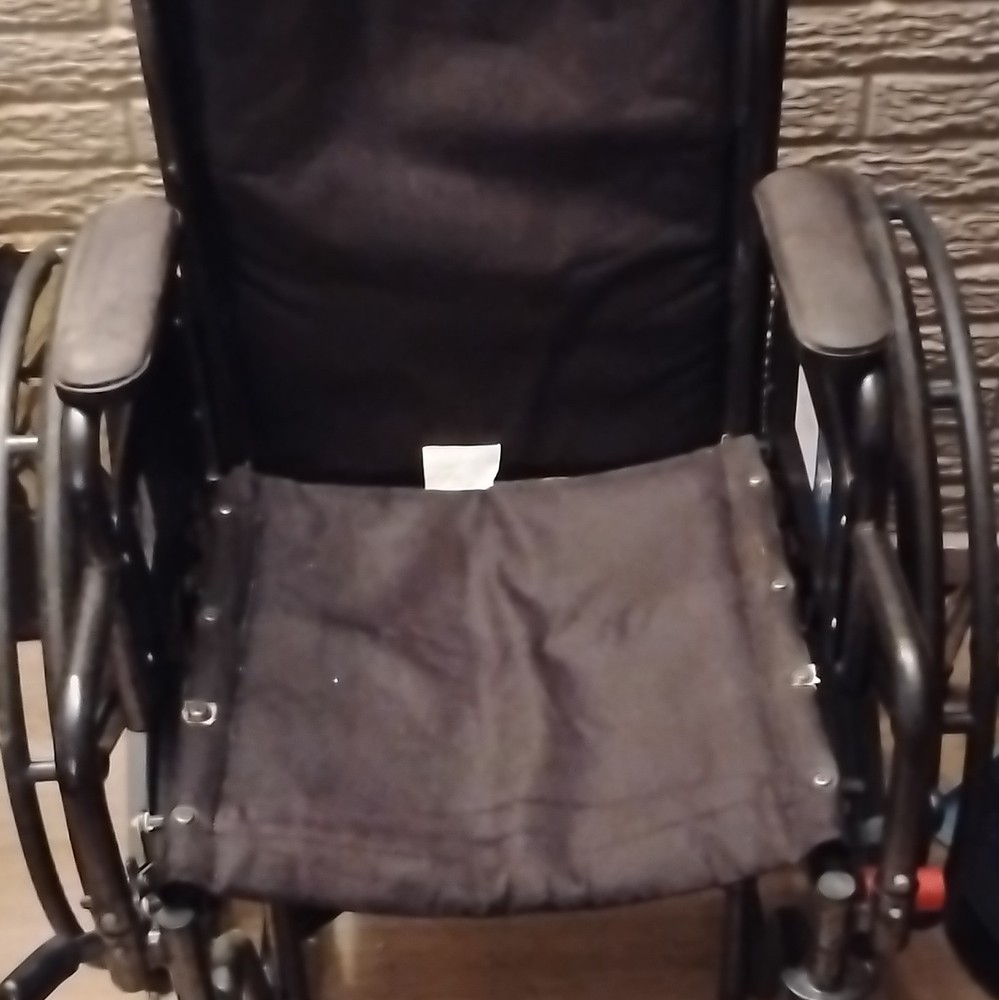 Black Manual Wheelchair, 4-Wheel Design with Padded Armrests