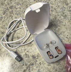 used beige Truhearing premium hearing aids behind the ear with charging case