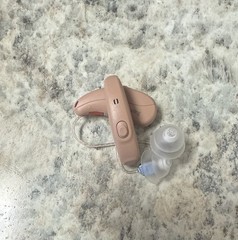 used beige Truhearing premium hearing aids behind the ear with charging case