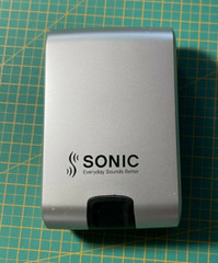 Hardcover Hearing Aid Case Sonic Push Button Spring Silver/Black 3.5″ x „2 x 1“
