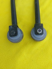 A PAIR OF QUICKIE V-121 MOTORIZED WHEELCHAIR ANTI-TIPPERS With Bolts