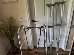 Raised adjustable toilet seat, cane, walker, and crutches.