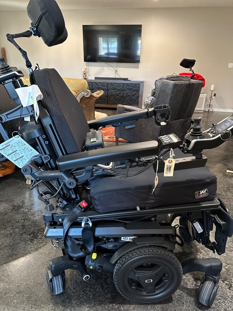 Brand new Quantum power chair, lightly used shower chair and other medical equip