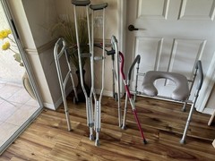 Raised adjustable toilet seat, cane, walker, and crutches.