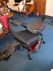 Electric wheel chair red and black Quickie Q500M promaybe has 2 hours on it