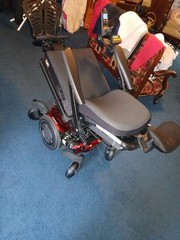 Electric wheel chair red and black Quickie Q500M promaybe has 2 hours on it