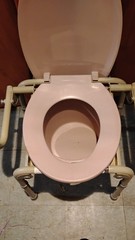 Bedside Commode Adjustable Height Plastic/Metal Beige Frame Pink Seat & Lid