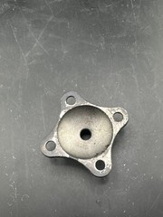 Prosthetic 4 hole male pyramid adapter component part.